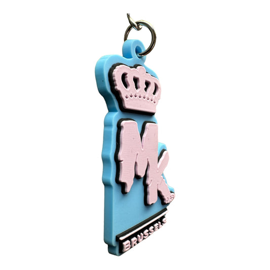 Porte-clés MK Brussels Magic King bleu aqua avec logo en relief et finition gluant
